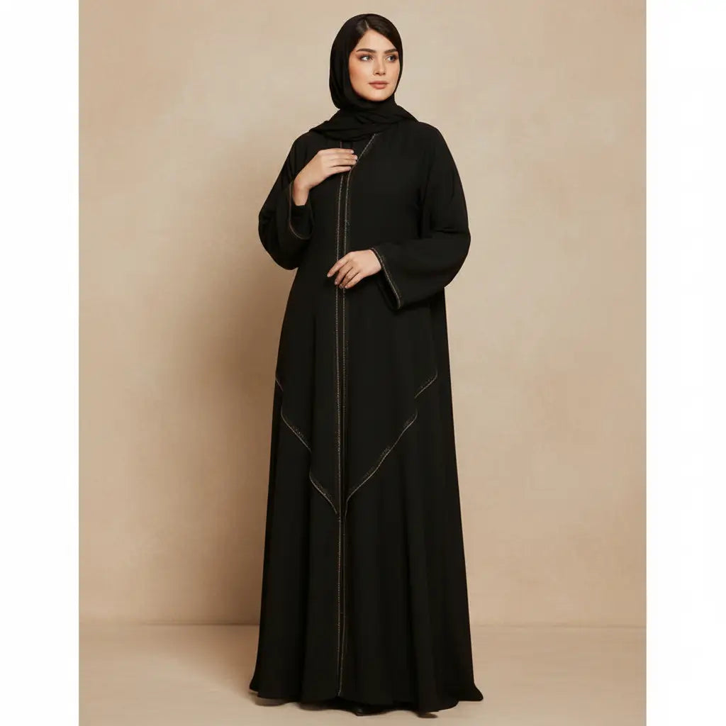 Woman wearing a black abaya against a beige background